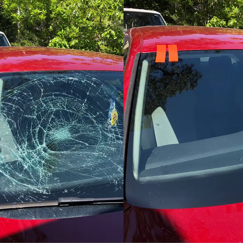 Red car windshield with a spidered impact break, left, and the new windshield with orange retention tape, right